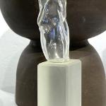 Clear blown glass figure on pedestal